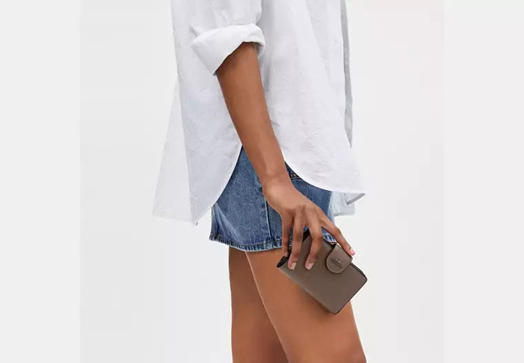 Coach Women's Medium Corner Zip Wallet in Signature Canvas