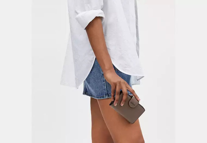 Coach Women's Medium Corner Zip Wallet in Signature Canvas