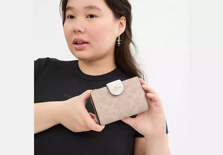 Coach Women's Medium Corner Zip Wallet in Signature Canvas